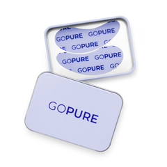 Open silver tin containing two reusable silicone under-eye patches printed with the goPure logo in blue.